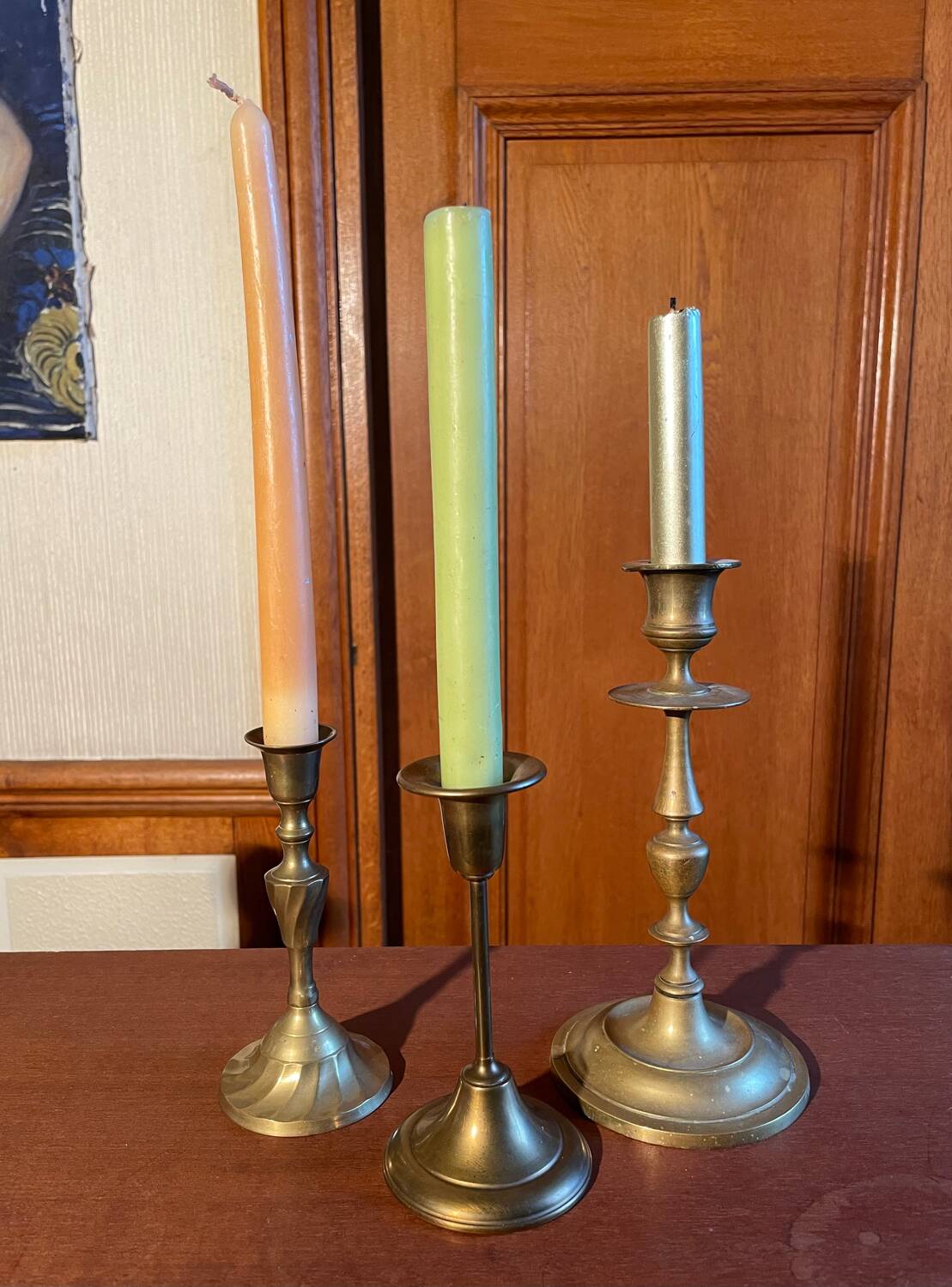 Trio of brass candlesticks