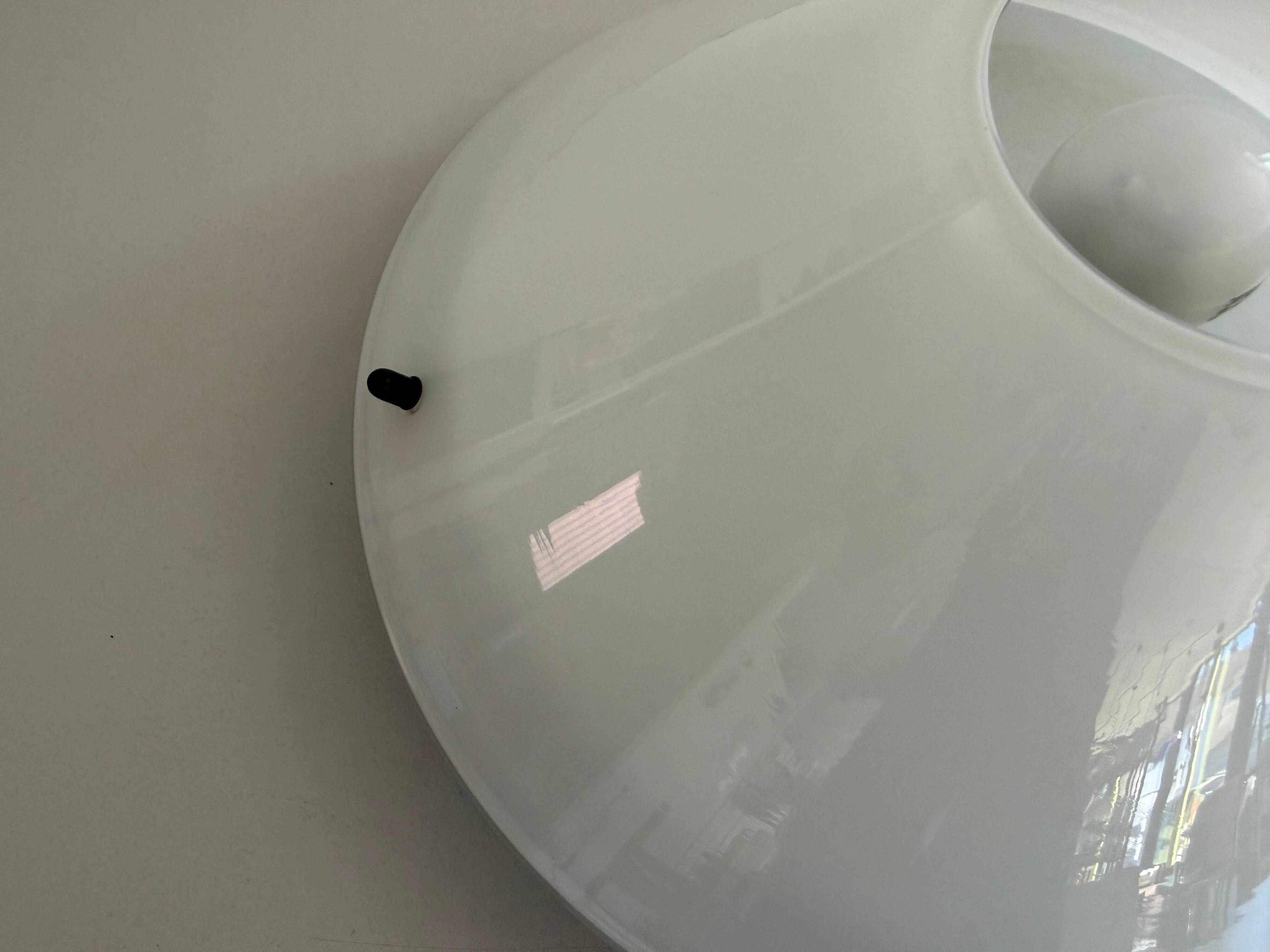 Simple opal glass wall light from the mid-century by Lamperti, 1960s, Italy.