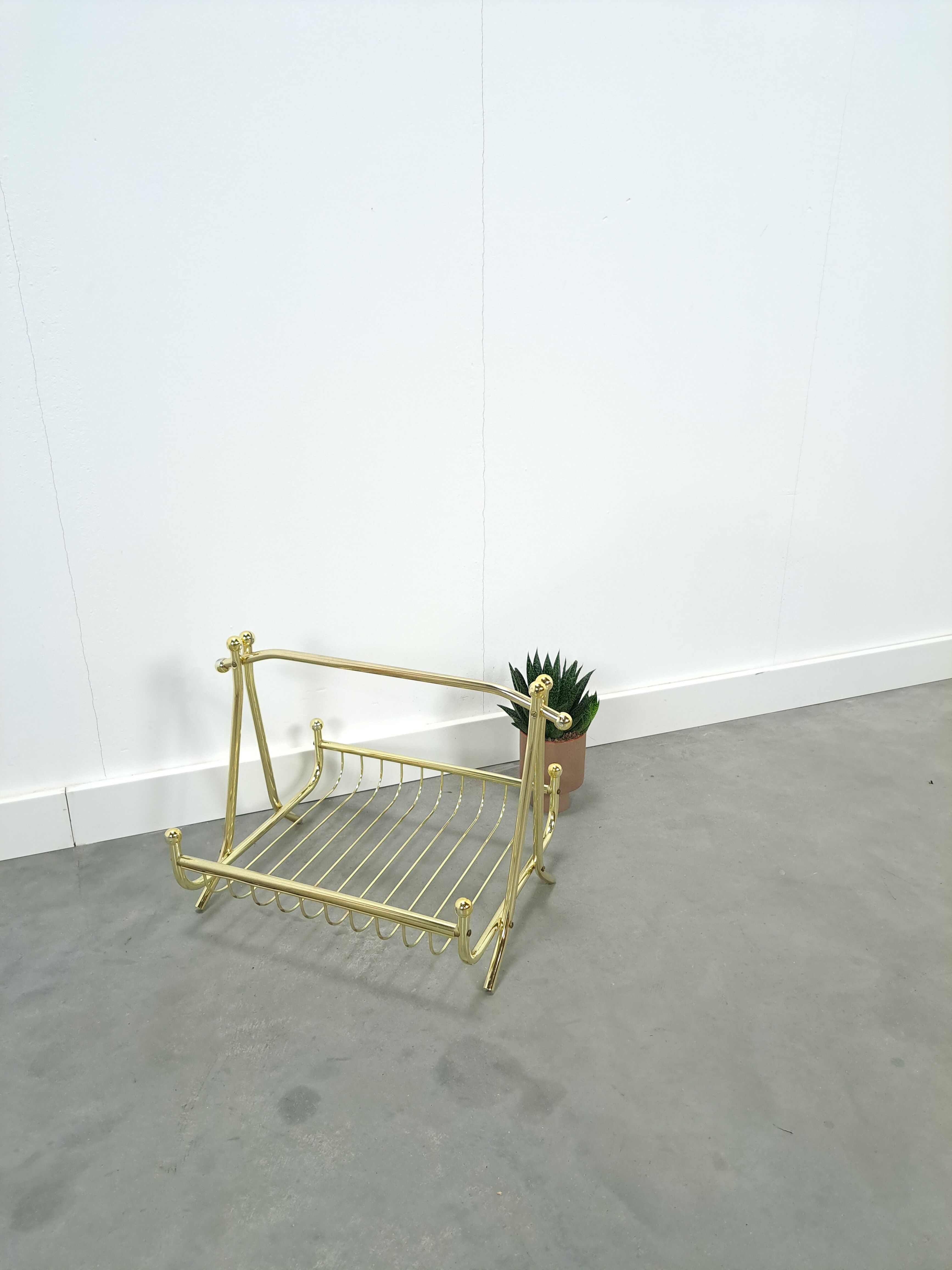 Gold magazine rack