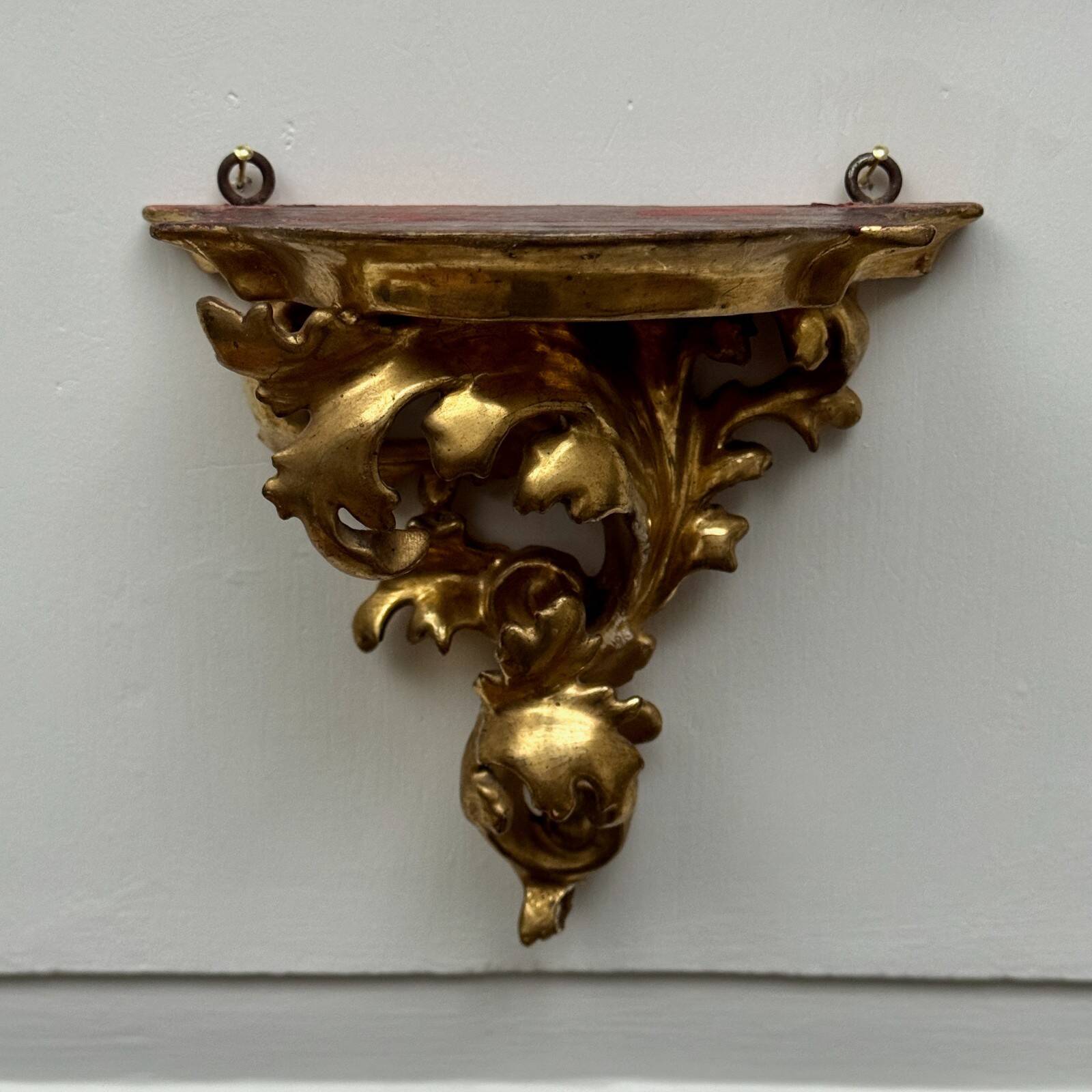 Set of three gilded wood consoles in Rococo style, late 19th century.