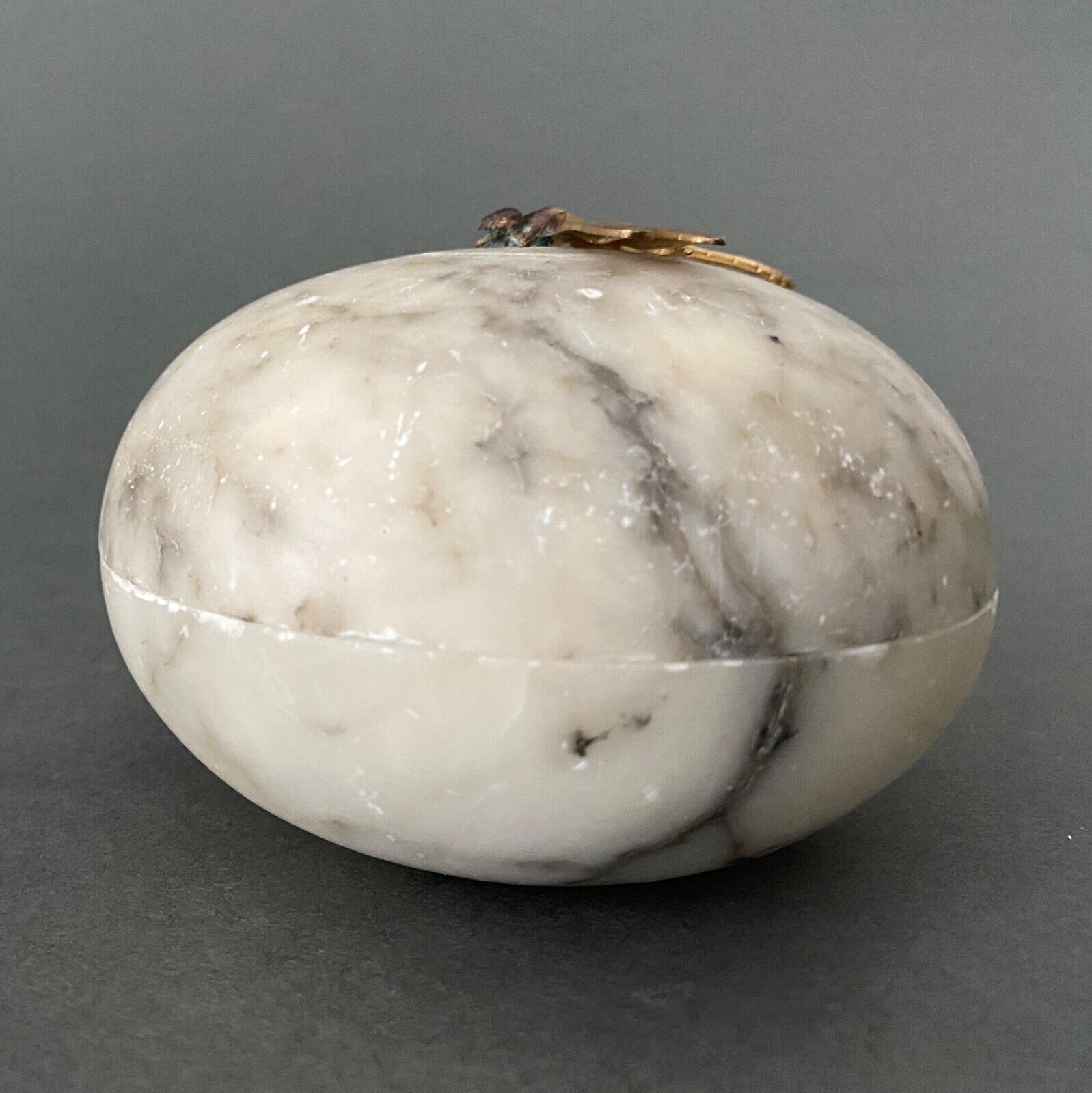 1900 alabaster ball shaped box surmounted by a golden dragonfly