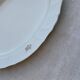 Large yellow porcelain serving dish by Bernadotte from the 1960s, with a gold rim and relief.