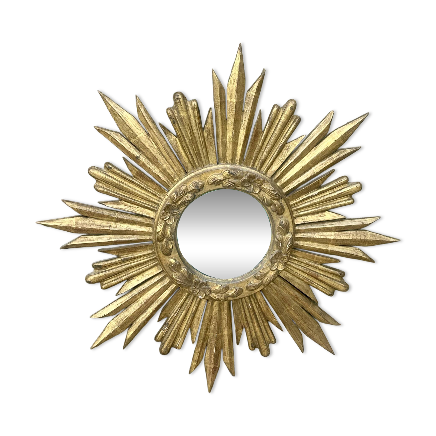 Large sun mirror in carved gilded wood.