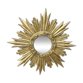 Large sun mirror in carved gilded wood.