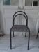 Industrial chair with a tubular metal frame in slate grey.