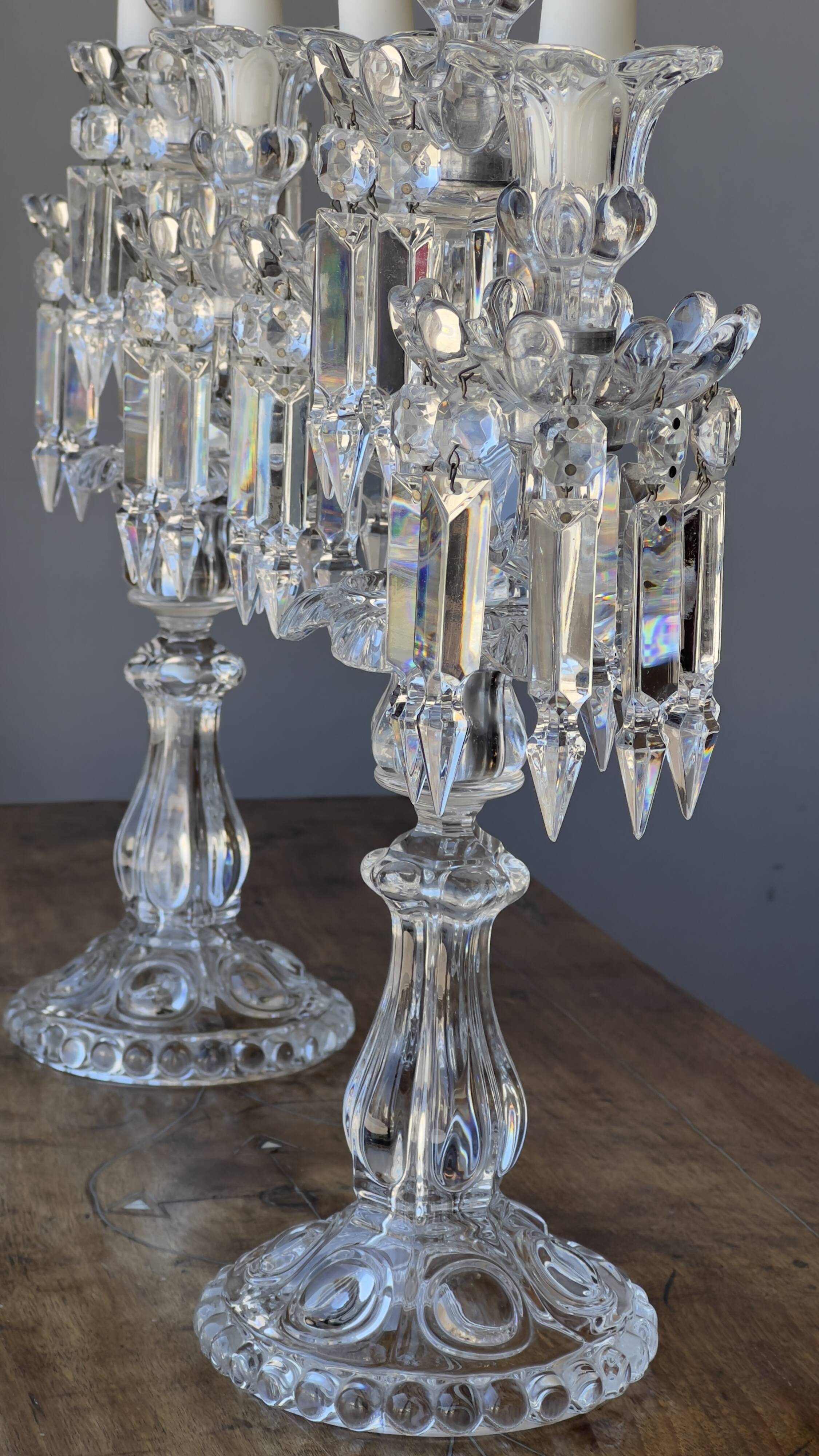 Pair of Baccarat three-light crystal chandeliers