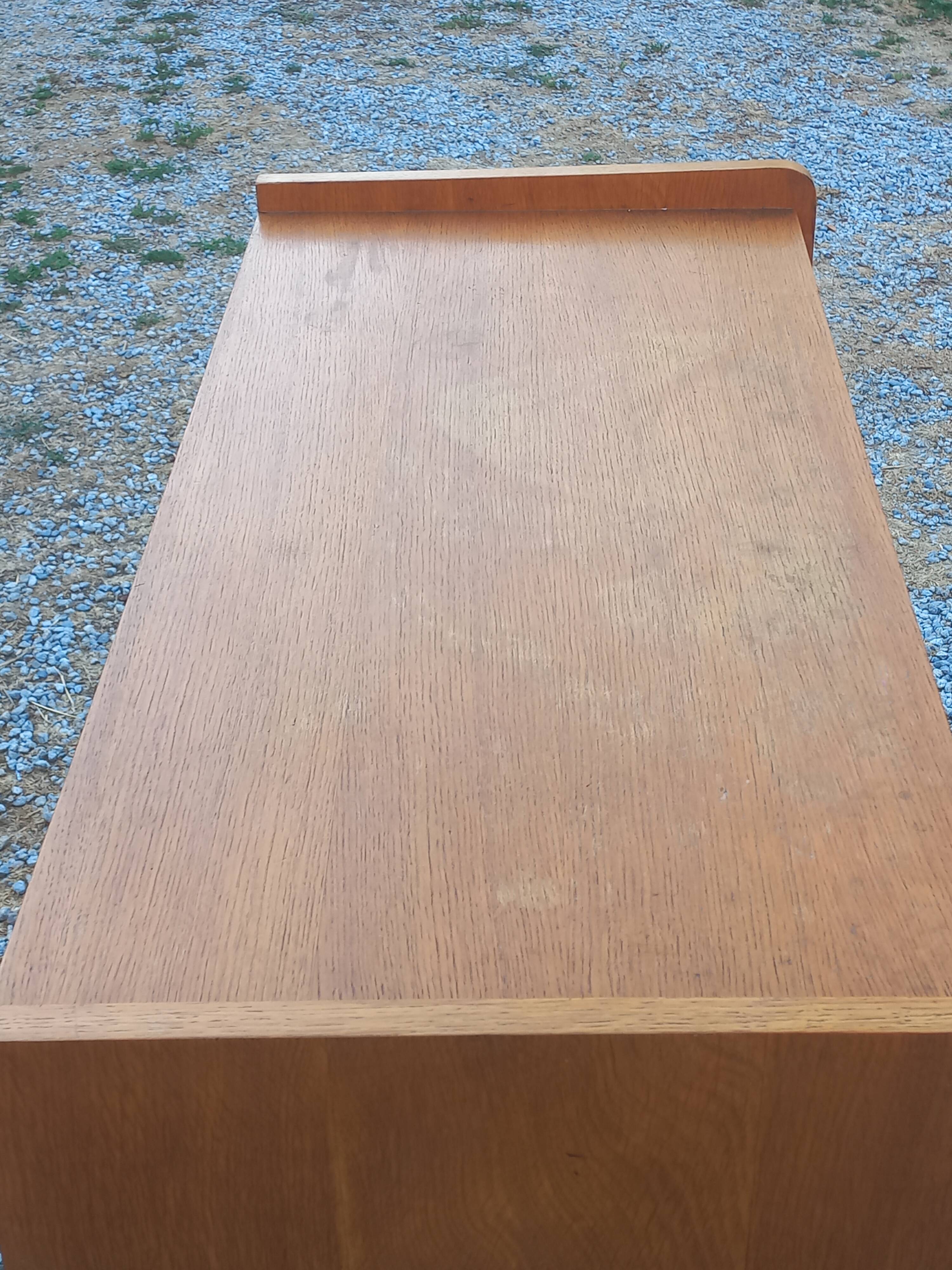 Commode vintage en chêne blond pieds compas 4 tiroirs 1950