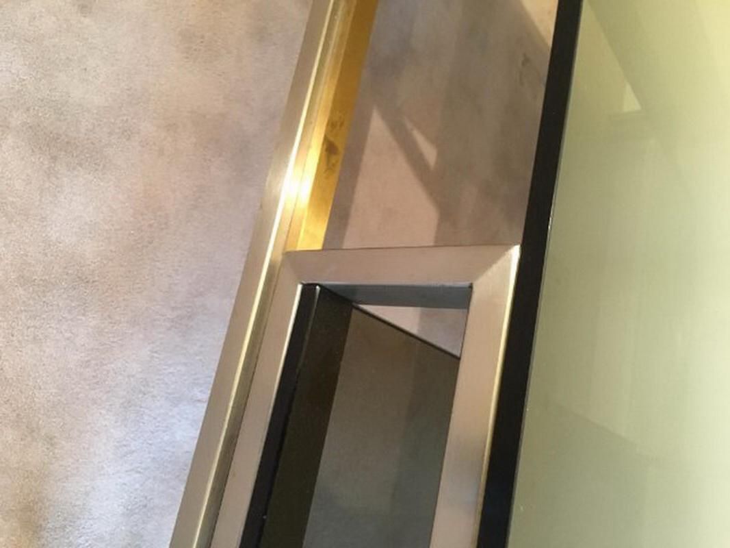 Very nice coffee table in brushed steel and brass