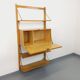 Wall shelf library with vintage light wood secretary bar