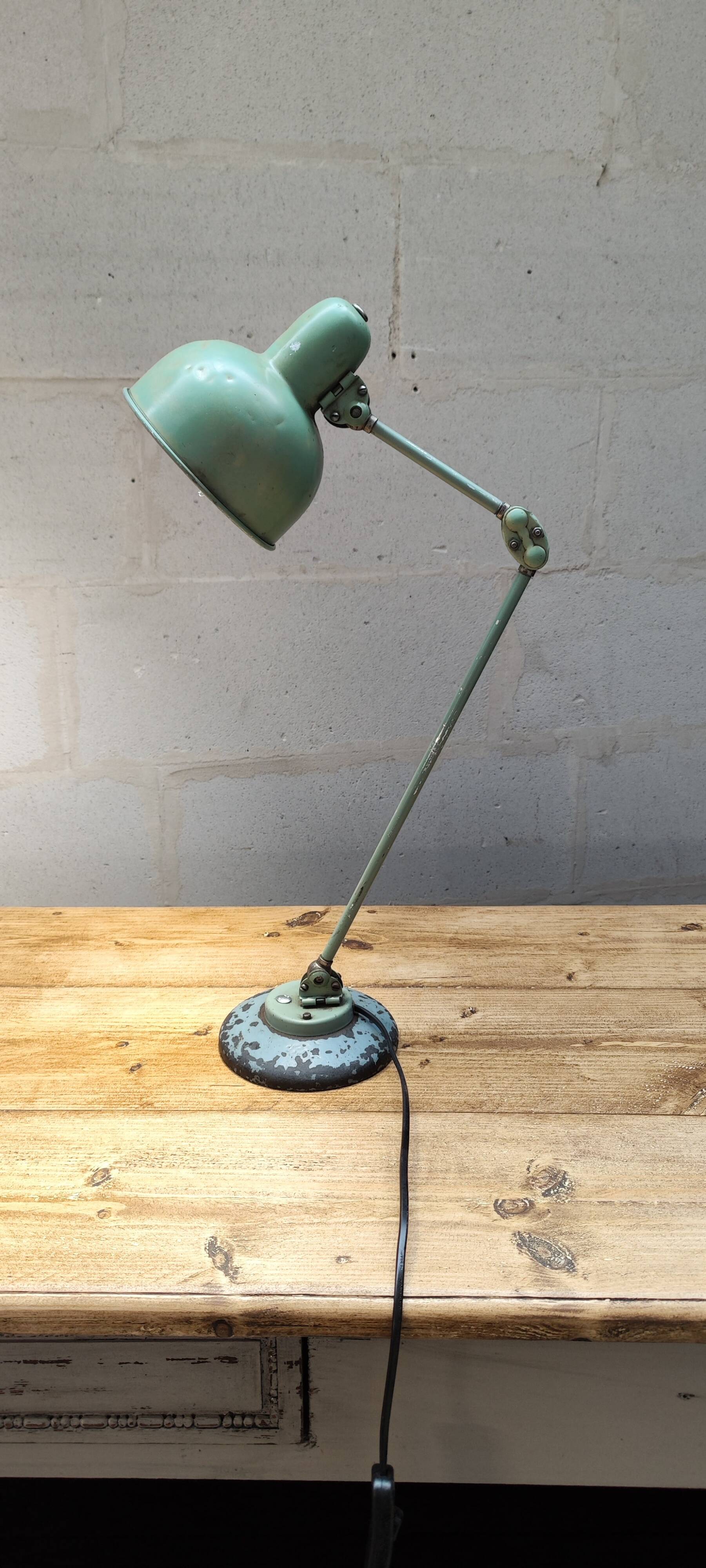 Old green industrial desk lamp