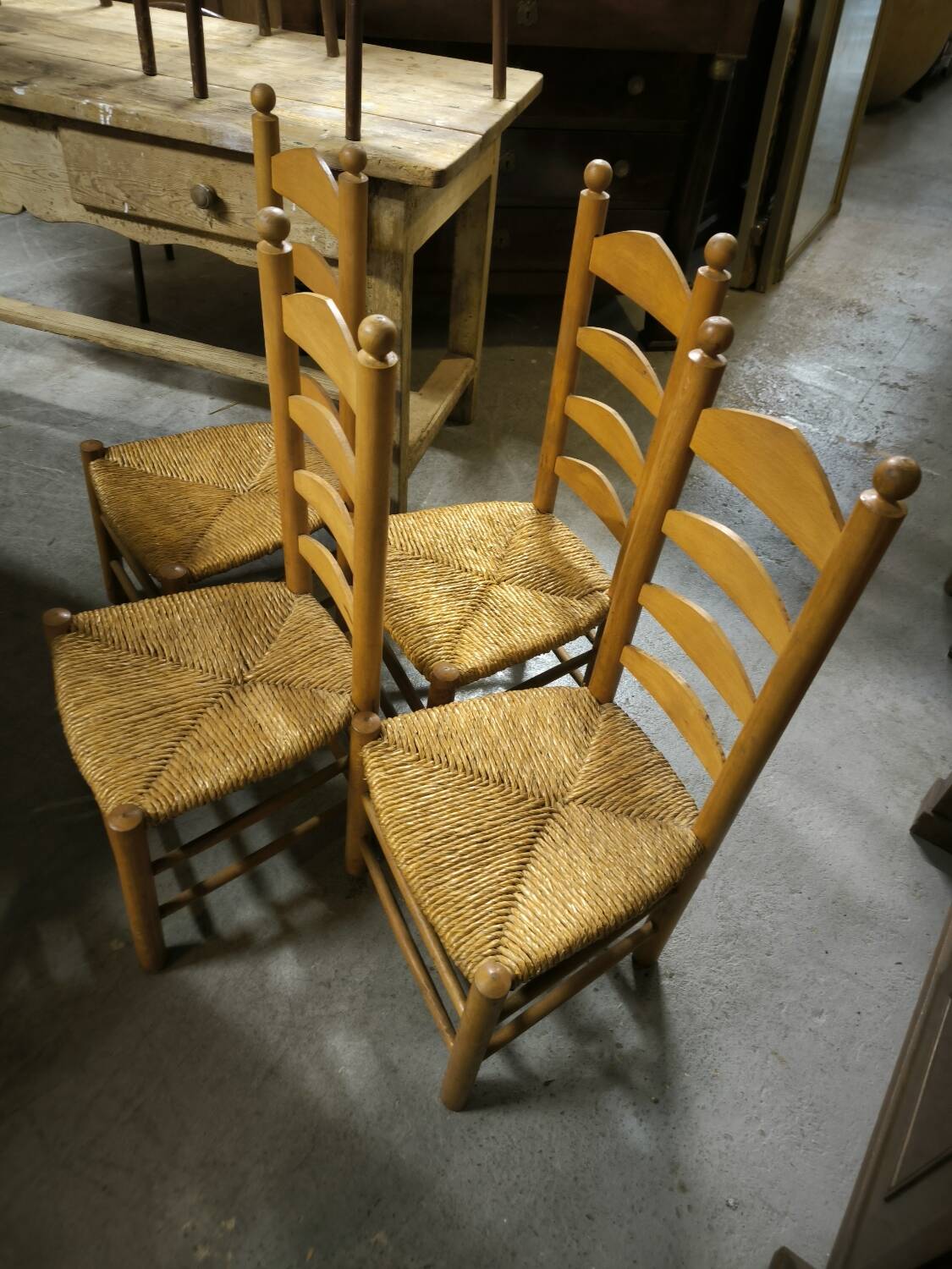 Set of 4 low straw-seated chairs circa 1940