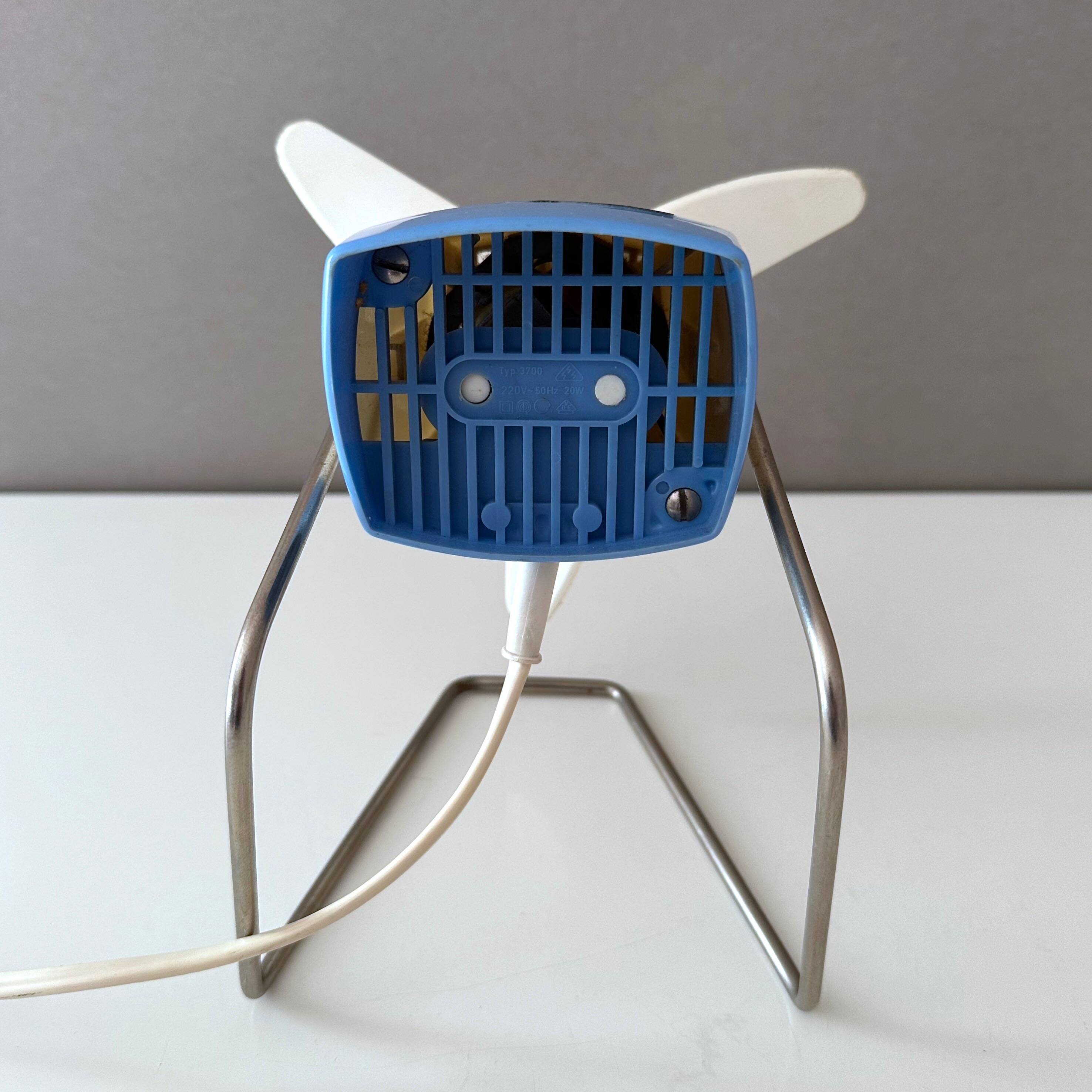 Blue Severin electric fan, mid-century office