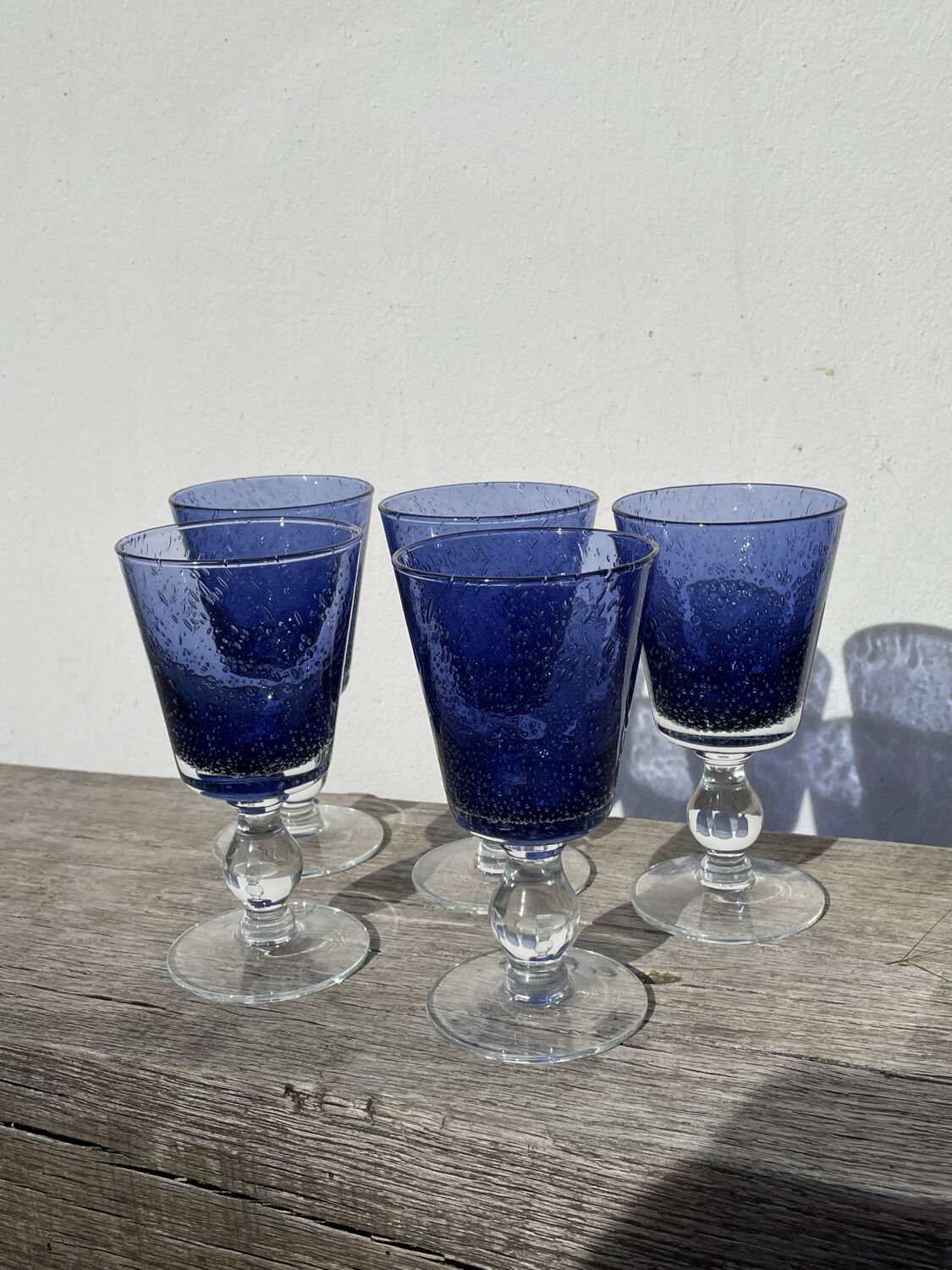 Set of 5 blue bubble stemmed glasses