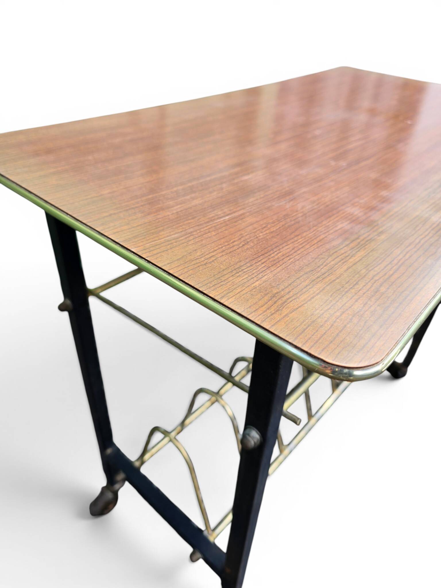 Vintage 1950s magazine table in metal and formica.
