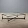 Small antique coffee table in black lacquered iron and glass, Italy, 20th century.