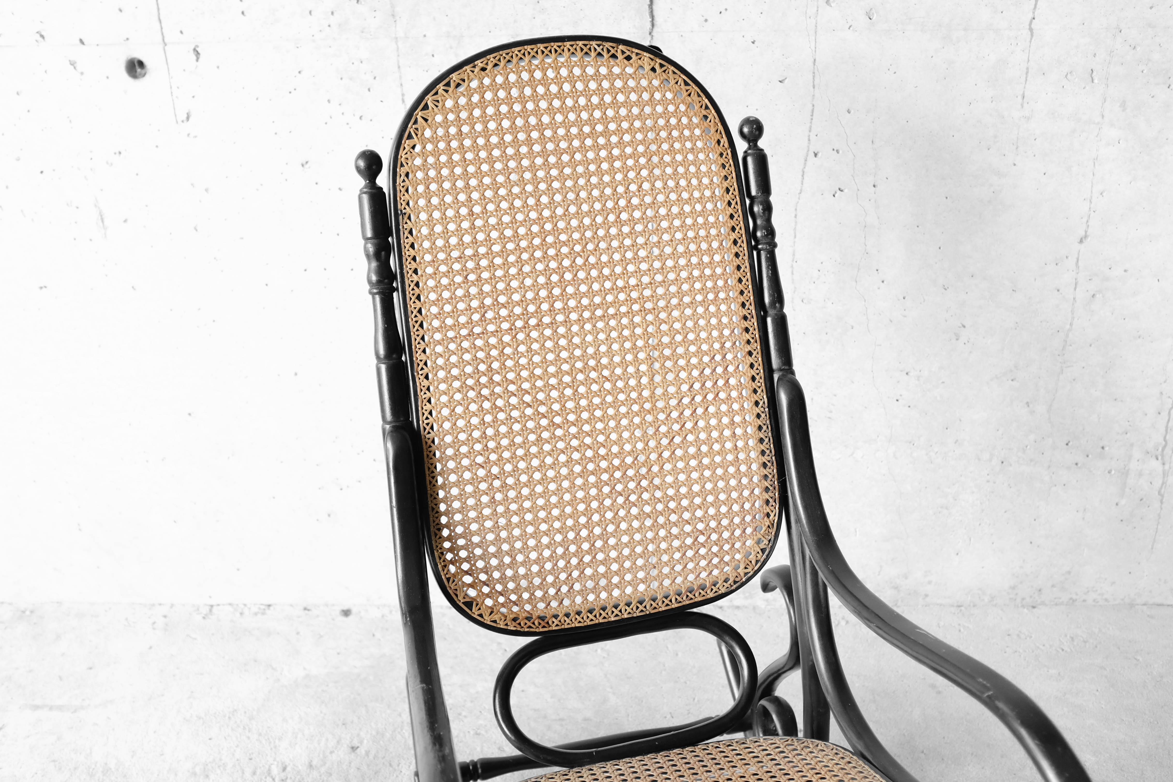 Black rocking chair in curved wood, years 50
