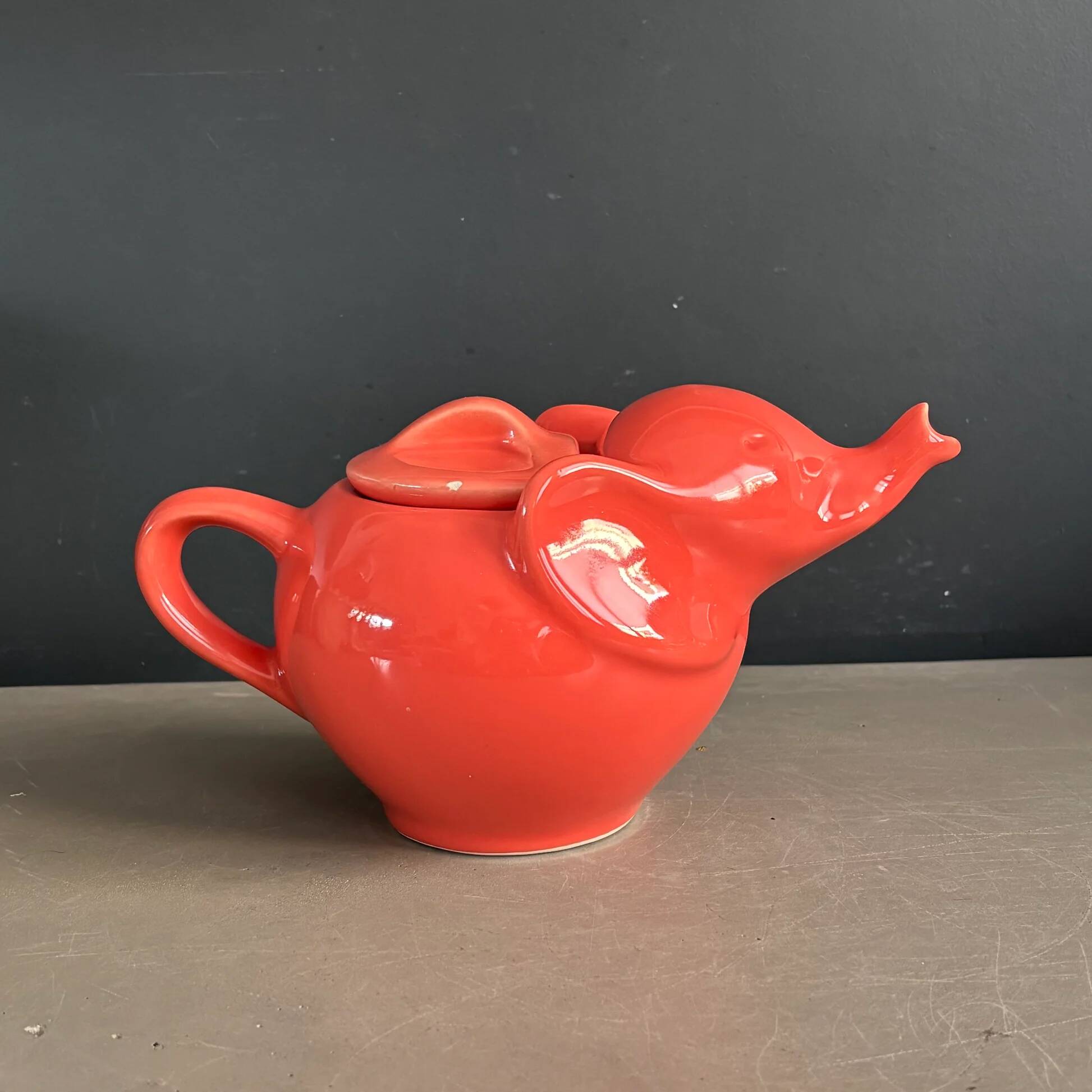 Large coral-coloured elephant teapot.