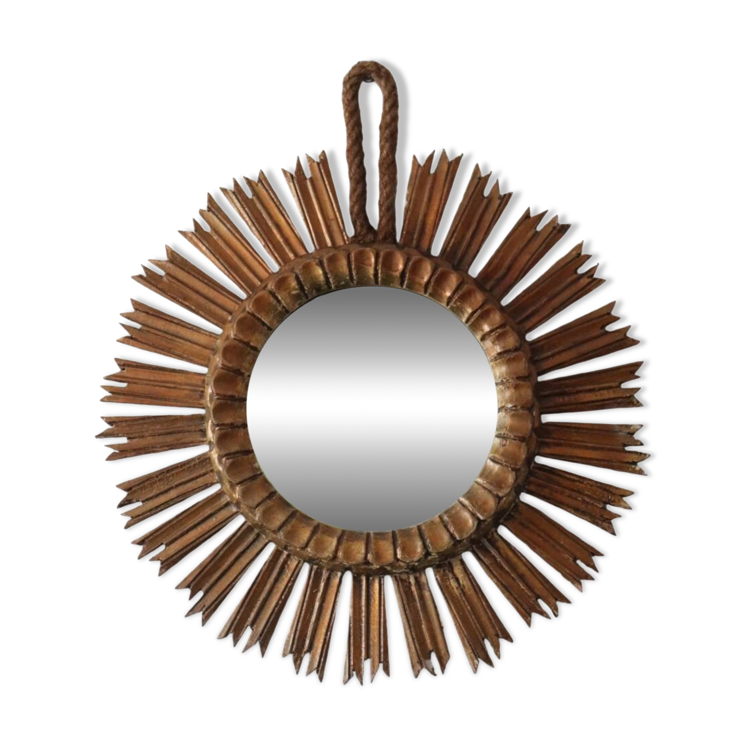 Old large sun mirror in gilded wood