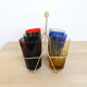 Set of 6 coloured glasses in their brass holder, basket
