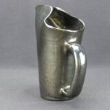 Old Biot, modernist pitcher in iridescent black ceramic.