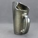 Old Biot, modernist pitcher in iridescent black ceramic.