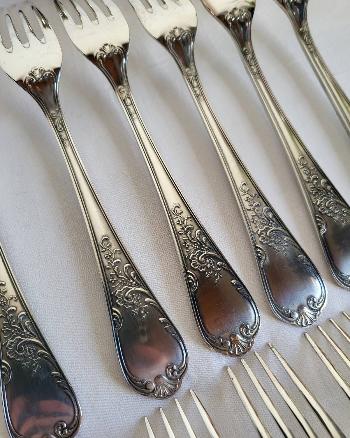 12 large silver-plated metal table forks by Guildart