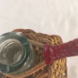 Bottle sheathed on the top and the low d wicker woven