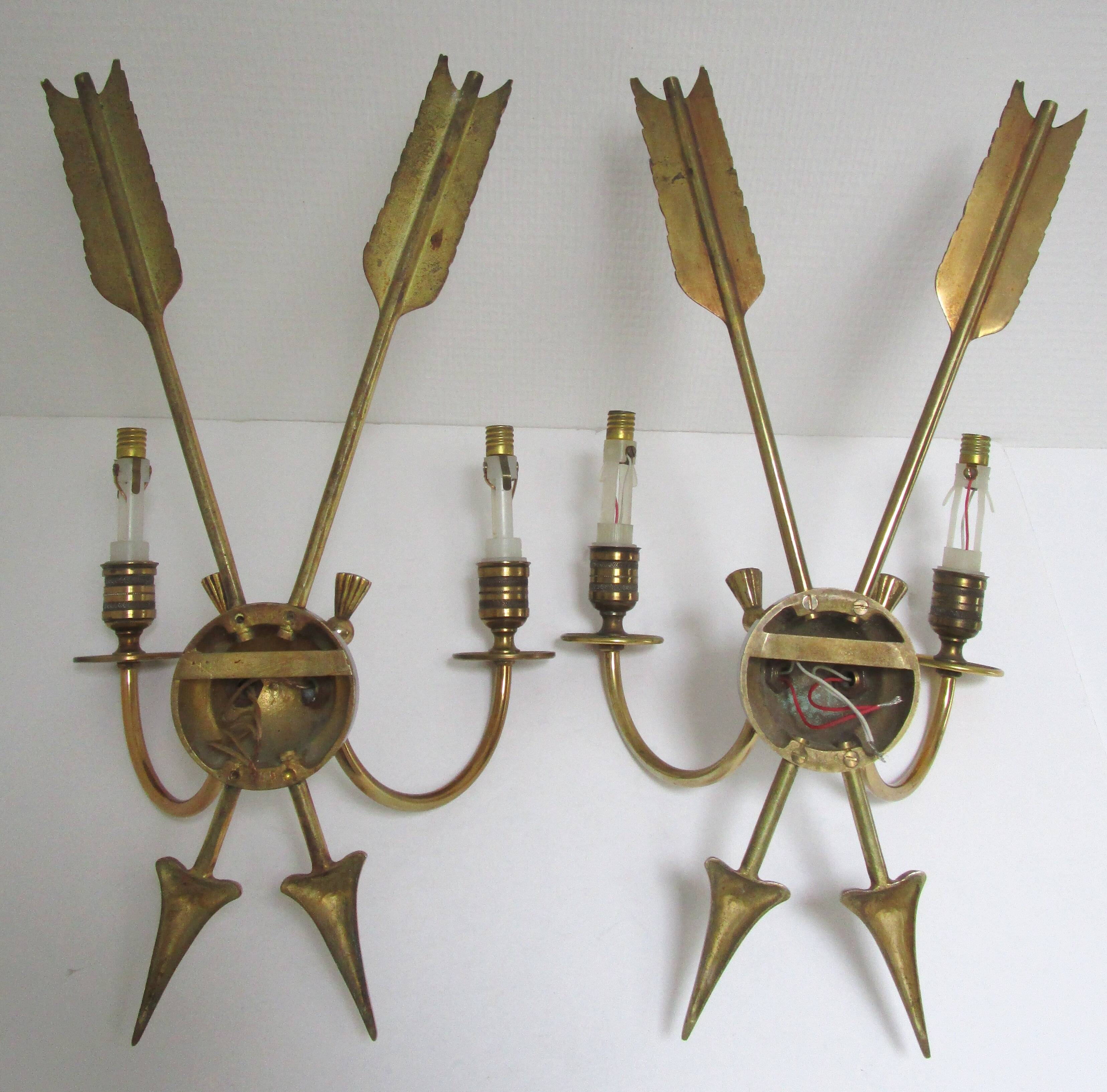 Pair of bronze crossed arrow wall lights Lucien Gau