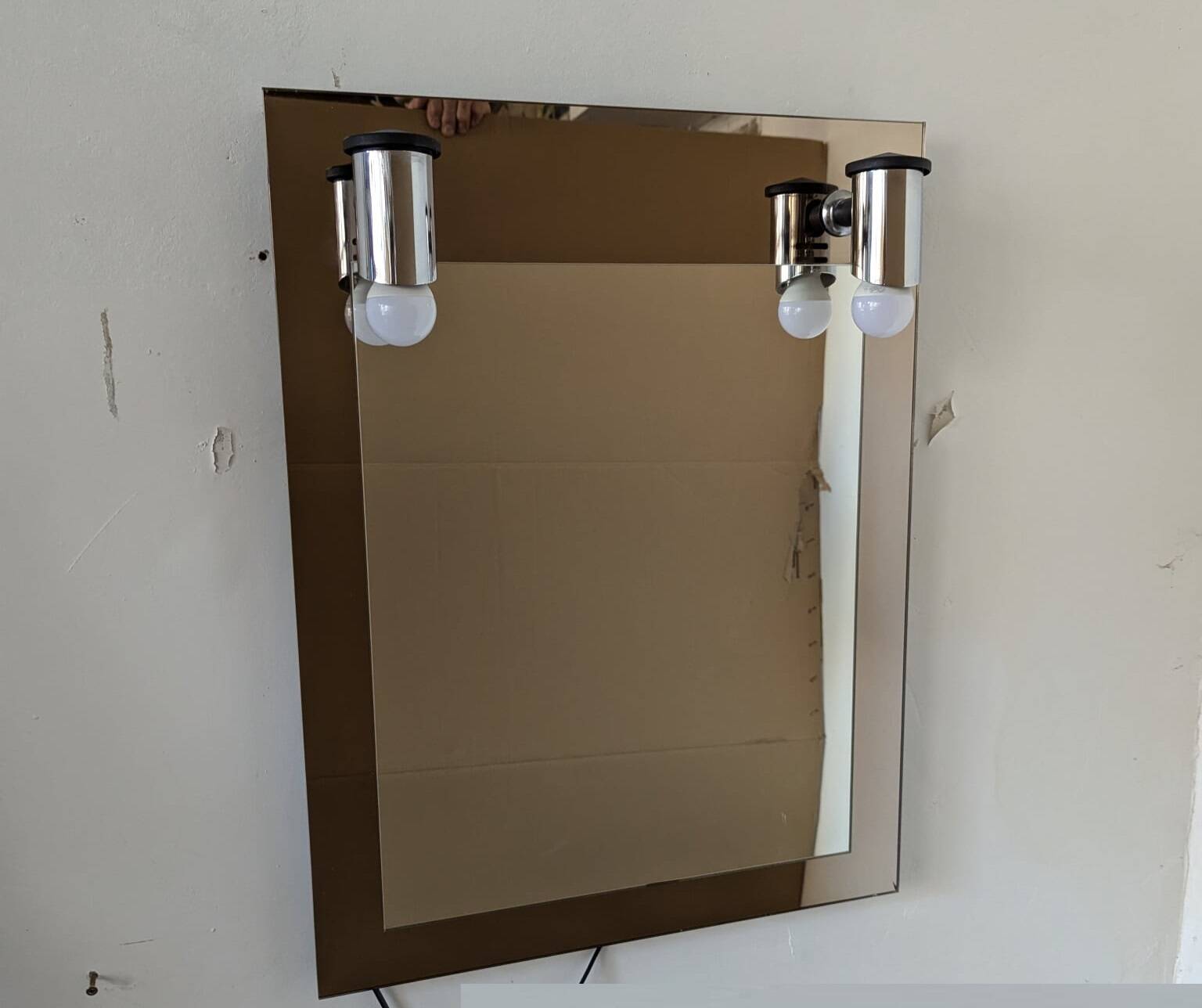 Vintage mirror with sconces.