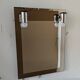 Vintage mirror with sconces.