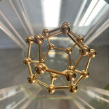 Golden brass atom