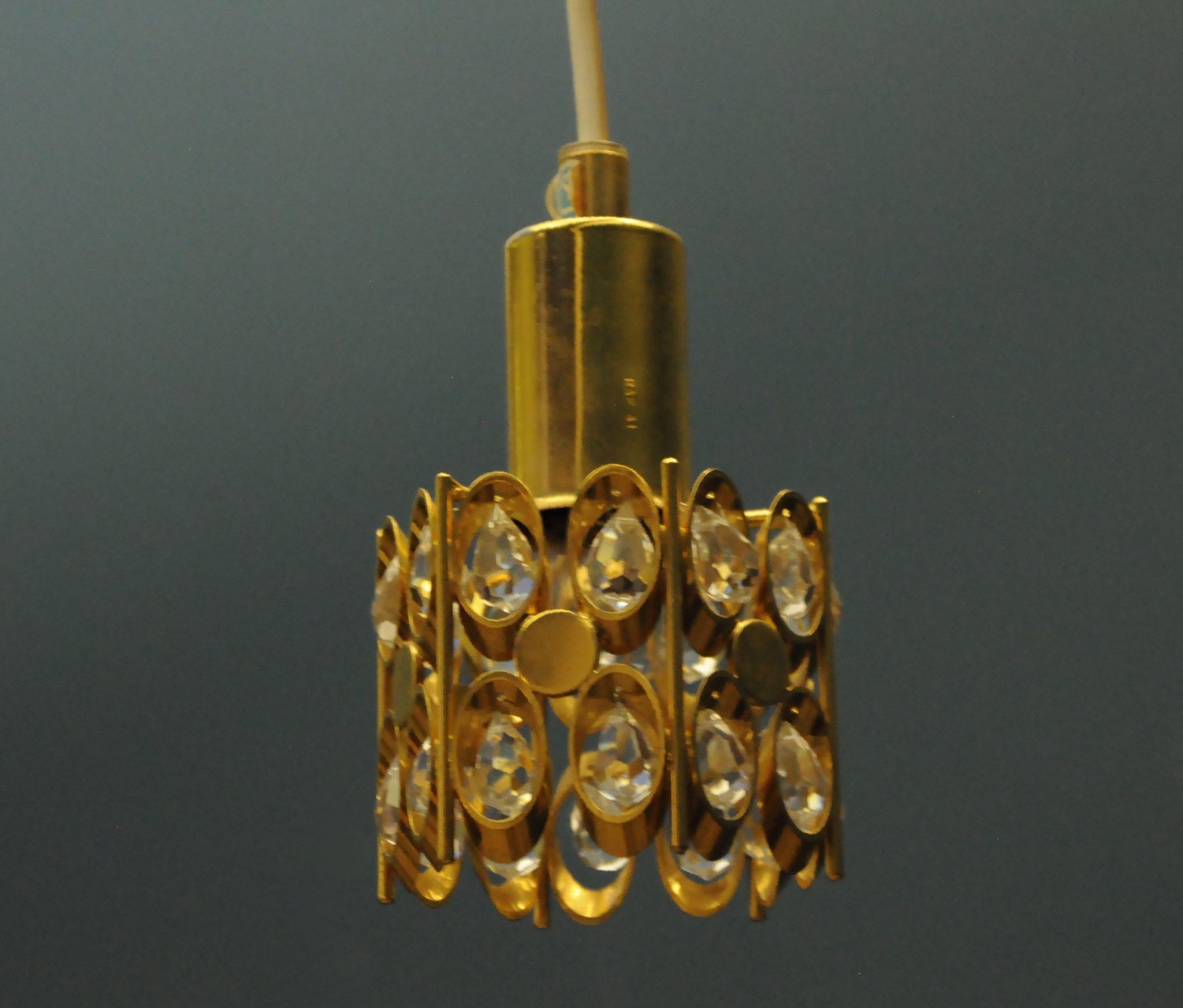 Ceiling lamp in the Hollywood Regency style. Golden.