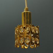 Ceiling lamp in the Hollywood Regency style. Golden.