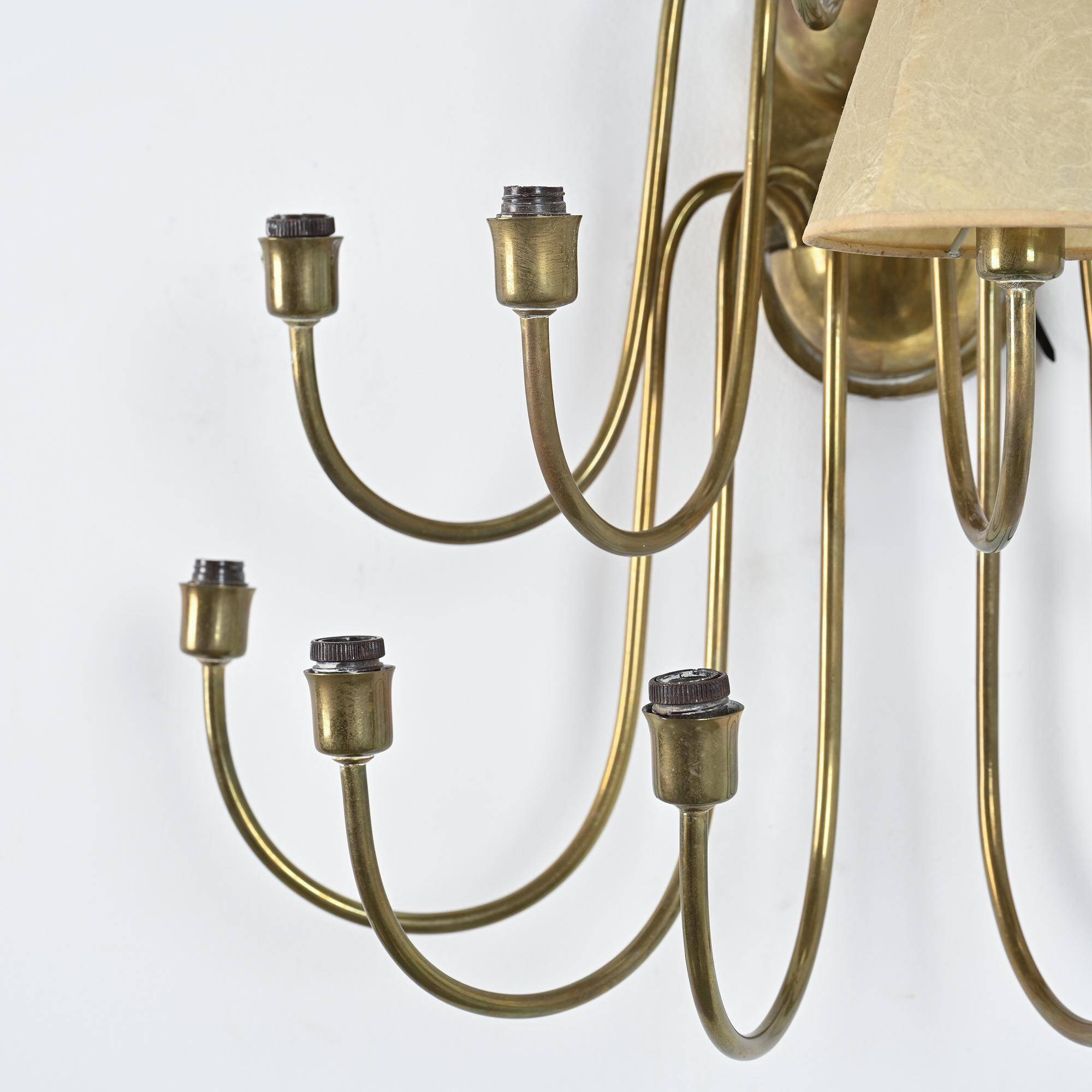 Wall sconce with nine arms in brass, France, circa 1950.