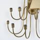 Wall sconce with nine arms in brass, France, circa 1950.