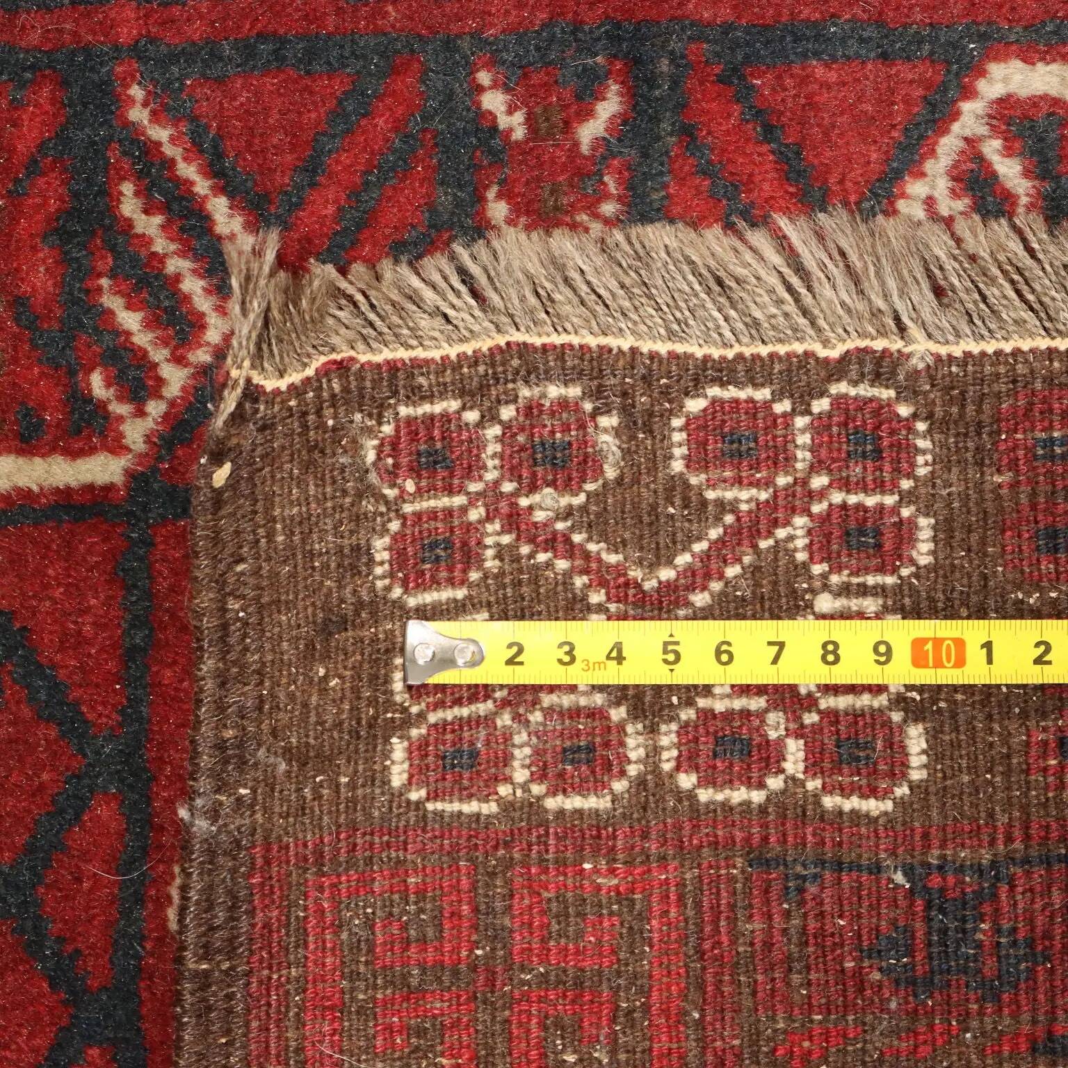 Ancient Asian wool rug, hand-knotted, 82 x 51 in.
