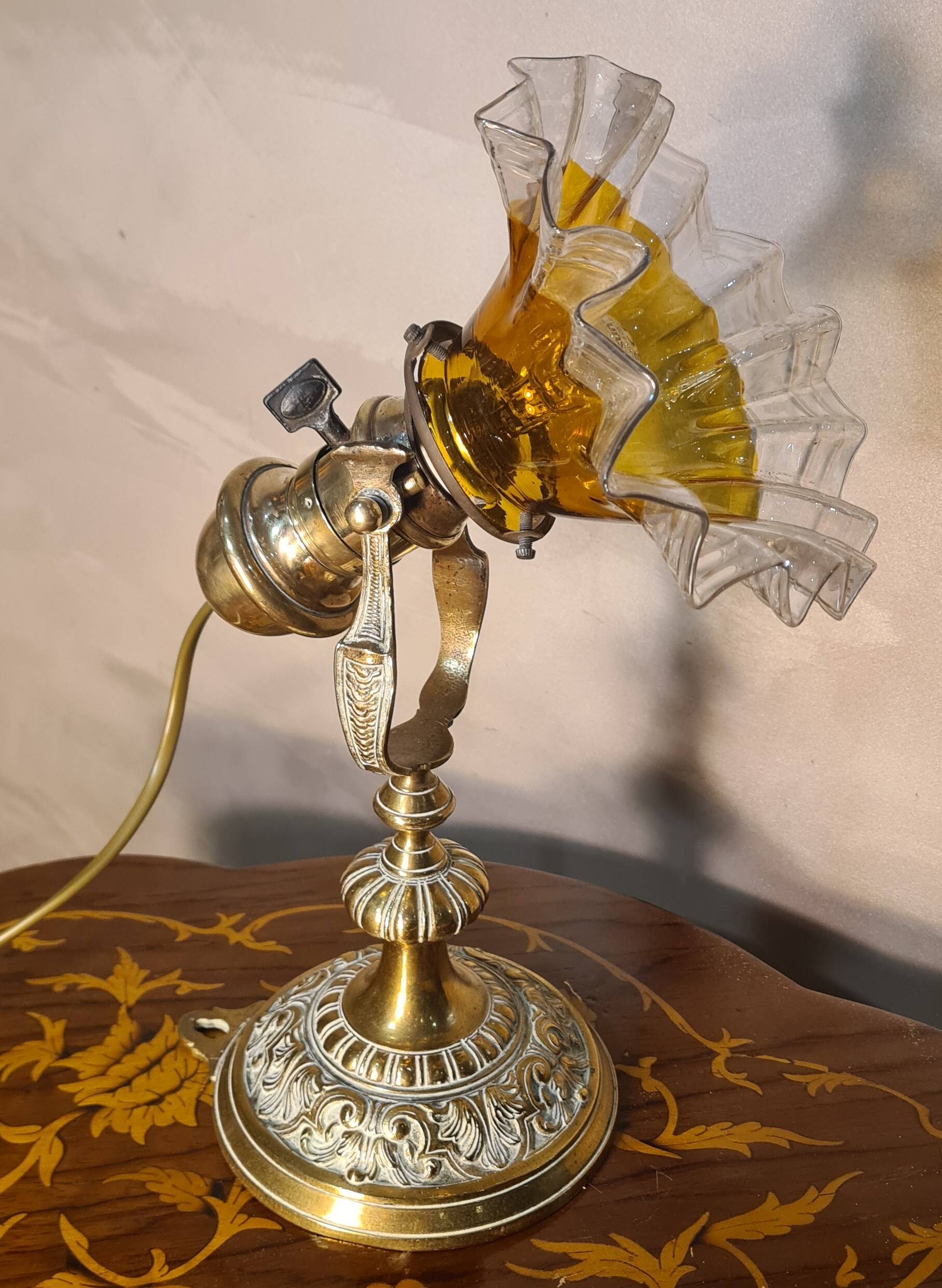 1920 bronze and brass rocking lamp with translucent amber-colored shade