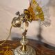 1920 bronze and brass rocking lamp with translucent amber-colored shade