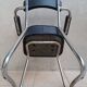 Vintage office chair in chrome metal and faux leather.