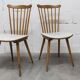 Pair of Baumann Menuet chairs, Honey patina, White skai seat
