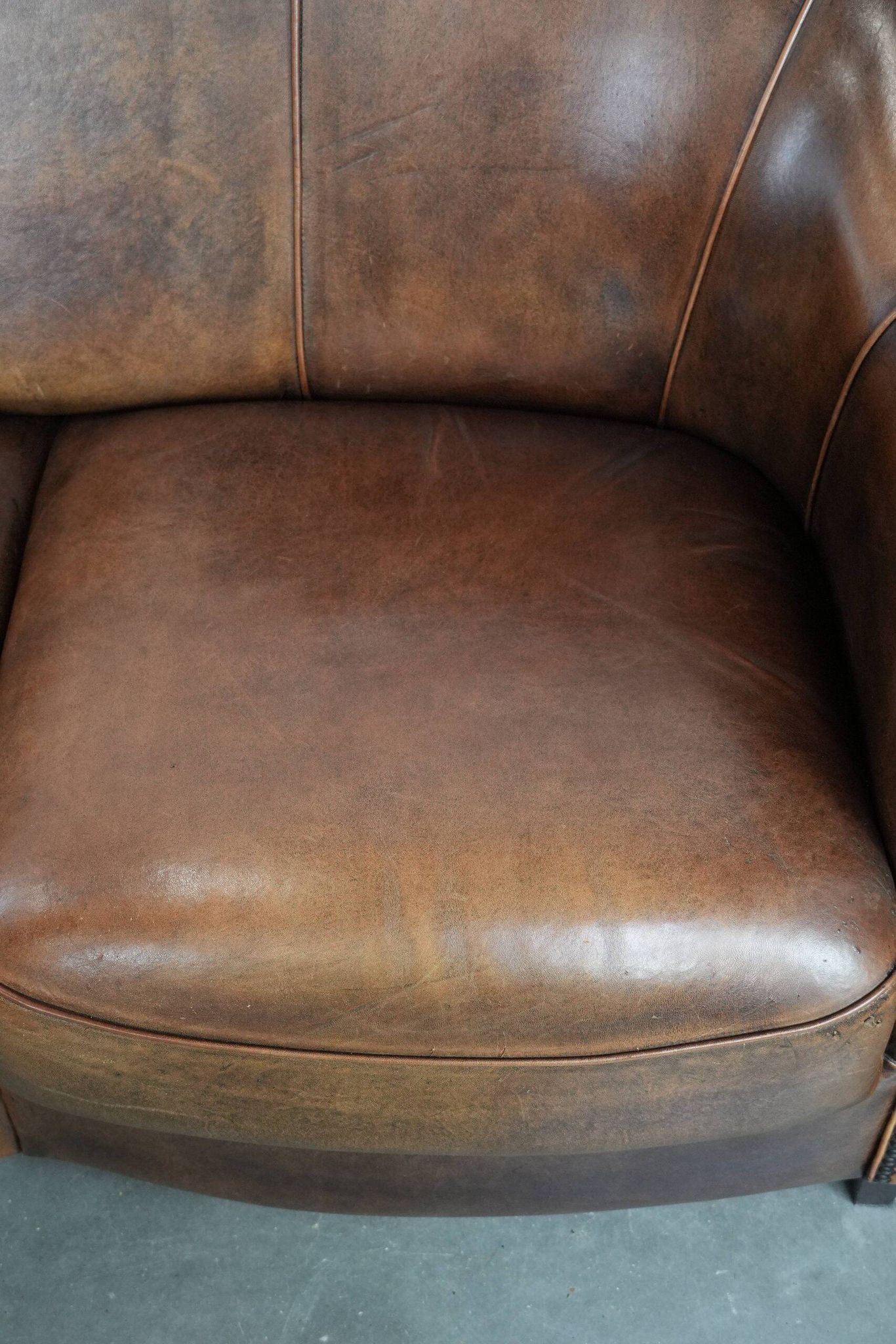 Characterful vintage sturdy 2-seater club sofa made of sheepskin leather