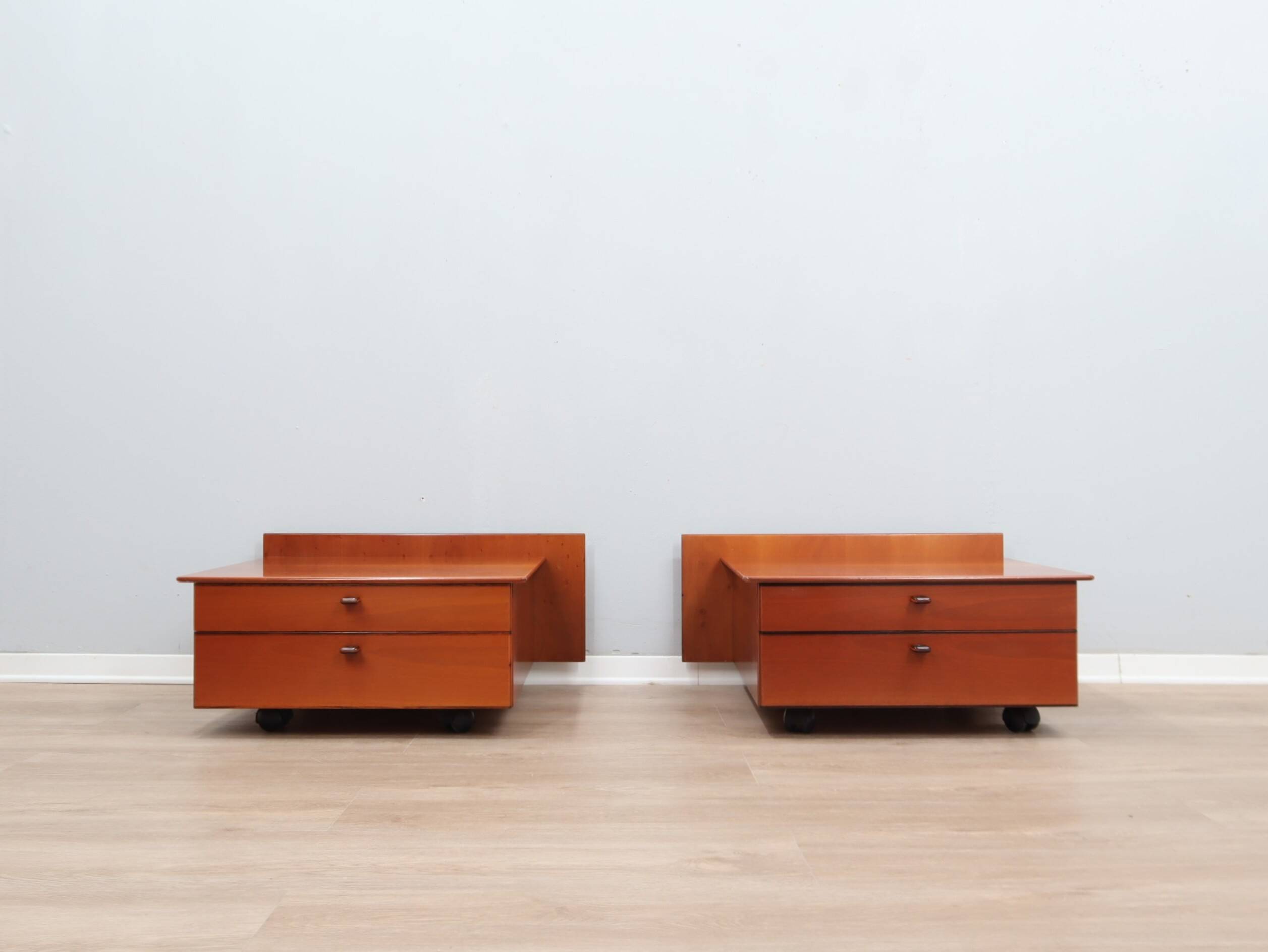 Pair of Stildomus walnut bedside tables with wheels 1970s
