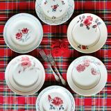 Old mismatched earthenware dinner plates accompanied by a deep dish
