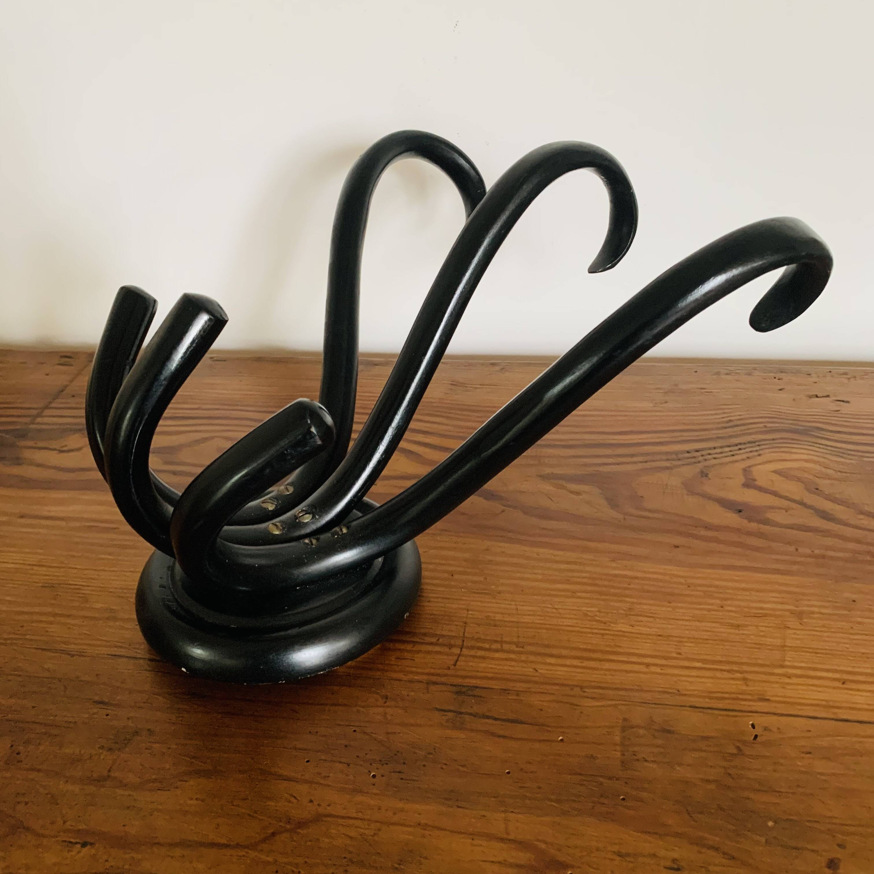 Wall-mounted coat rack with 3 hooks