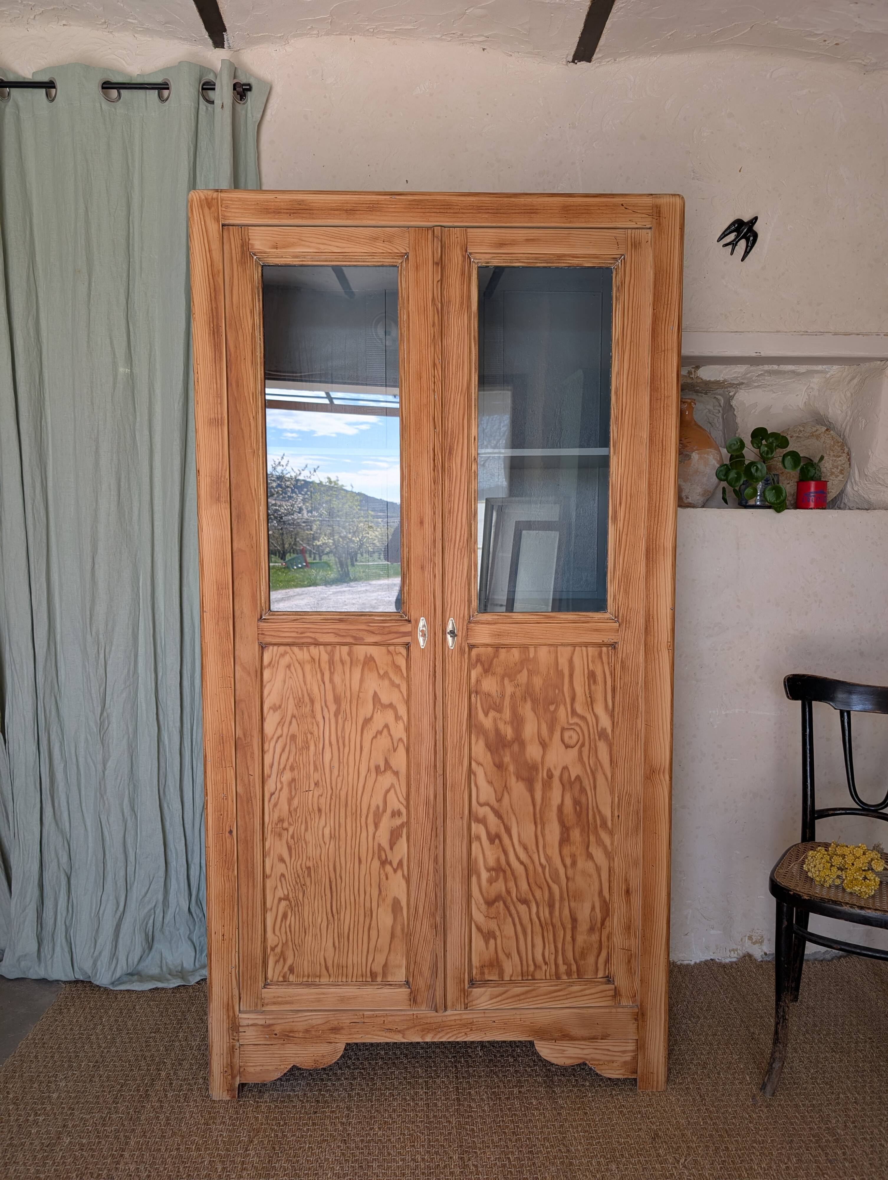 Old glass-fronted wooden library – blue interior