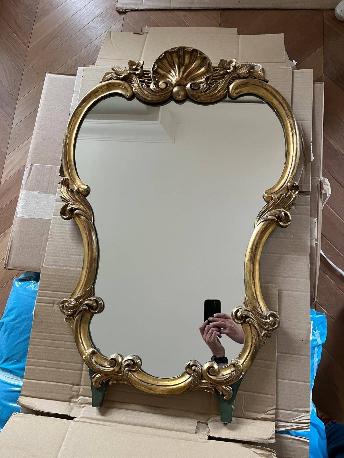 Large wall mirror with a gilded brass frame in Louis XV style.