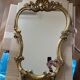 Large wall mirror with a gilded brass frame in Louis XV style.