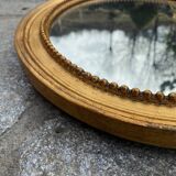 Antique gilded oval mirror