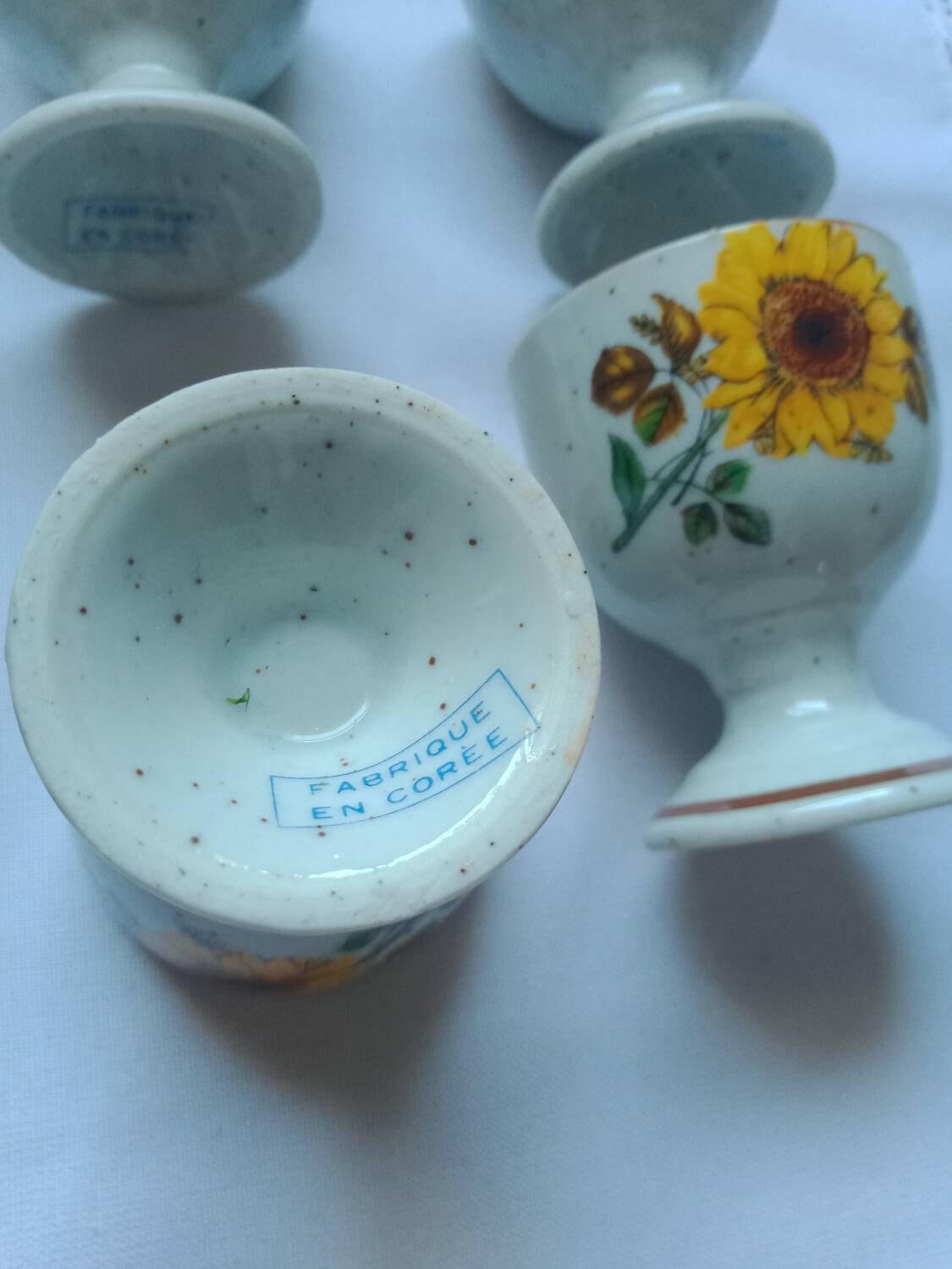 Stoneware egg cups screen printed with sunflowers