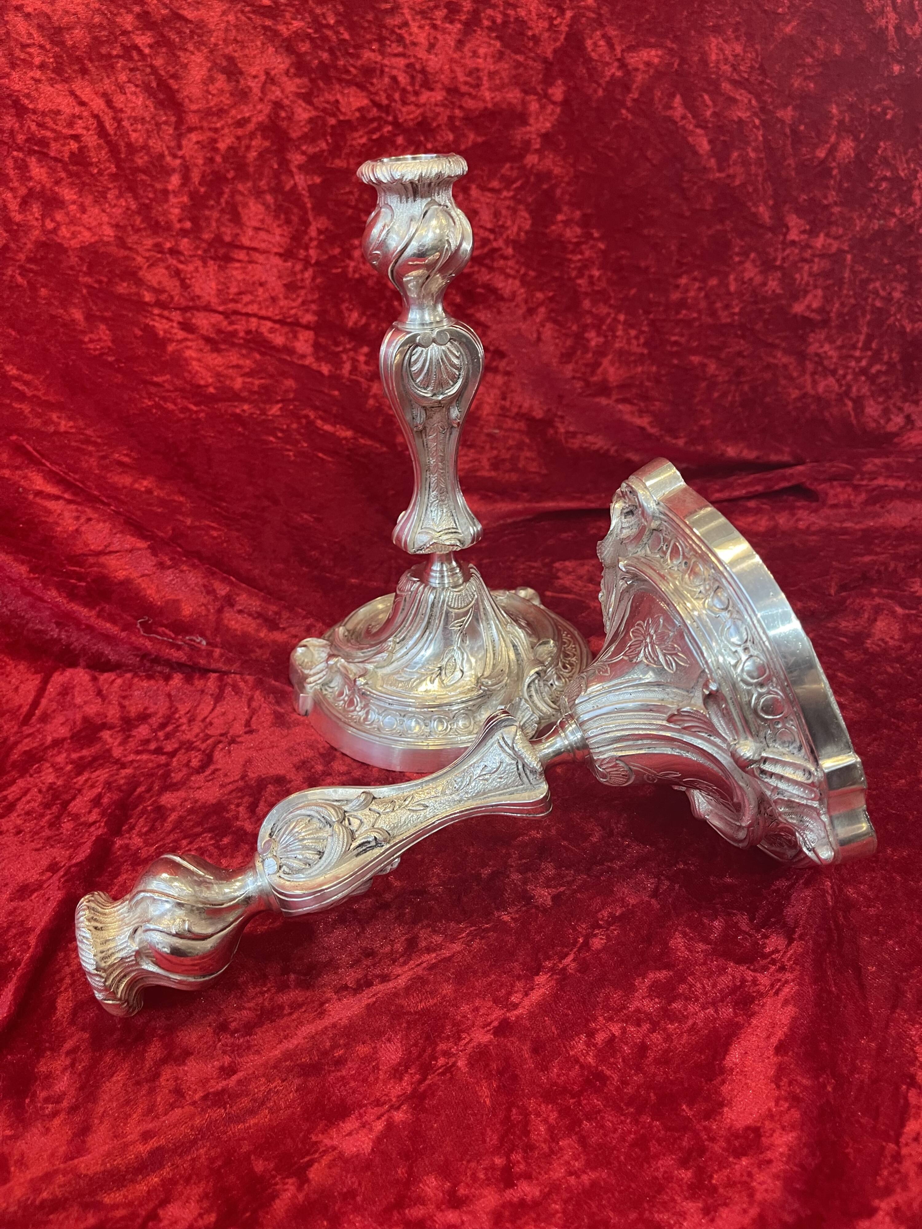 Pair of candlesticks, torches in silver bronze
